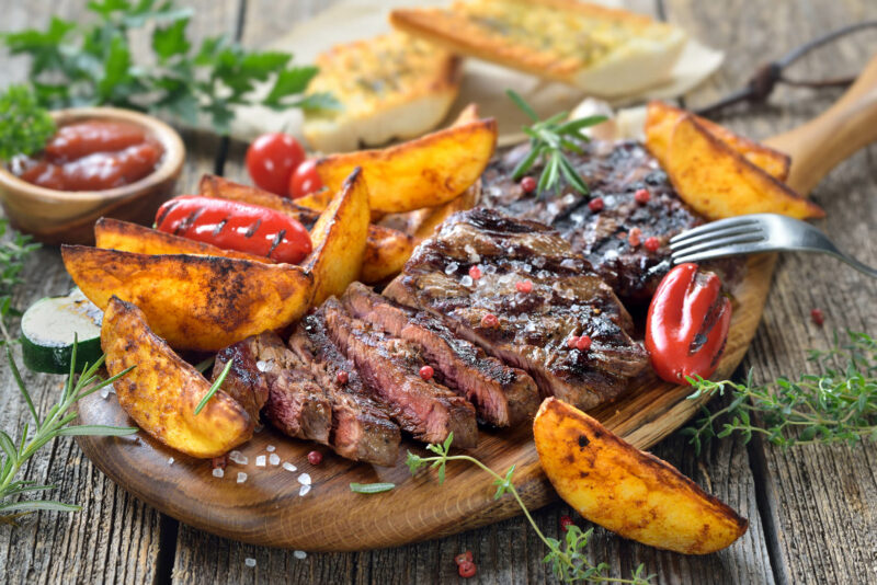 Grilled steak with potato wedges
